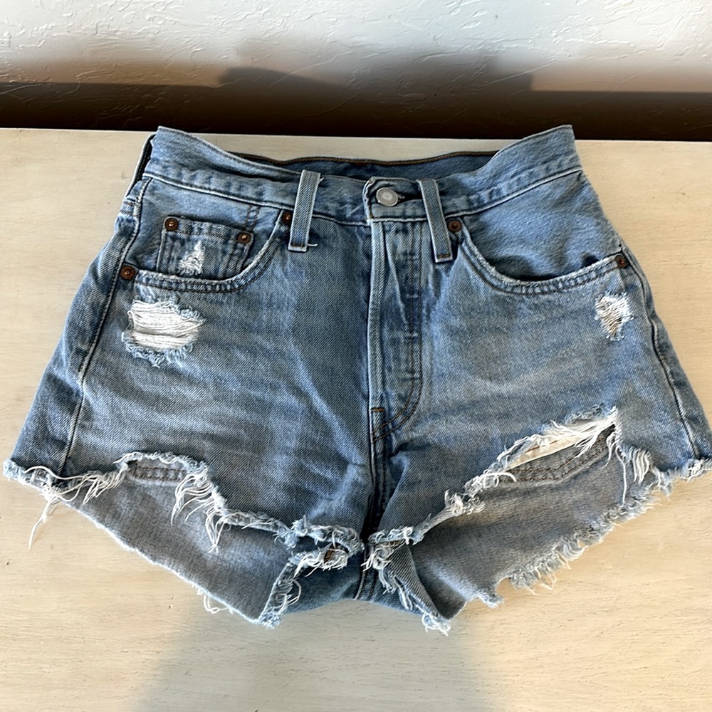Levi’s 501 button fly distressed Jean shorts size W24.